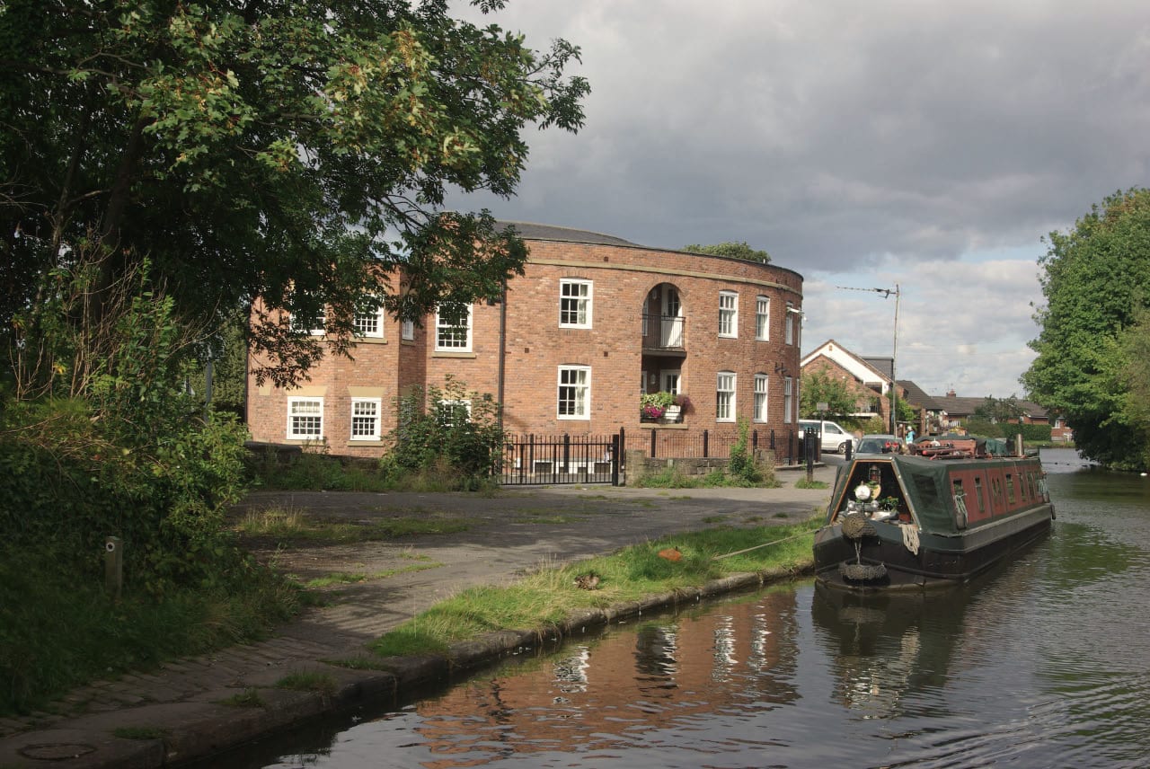 A narrowboat on the Bridgewater Canal by the towpath in Lymm