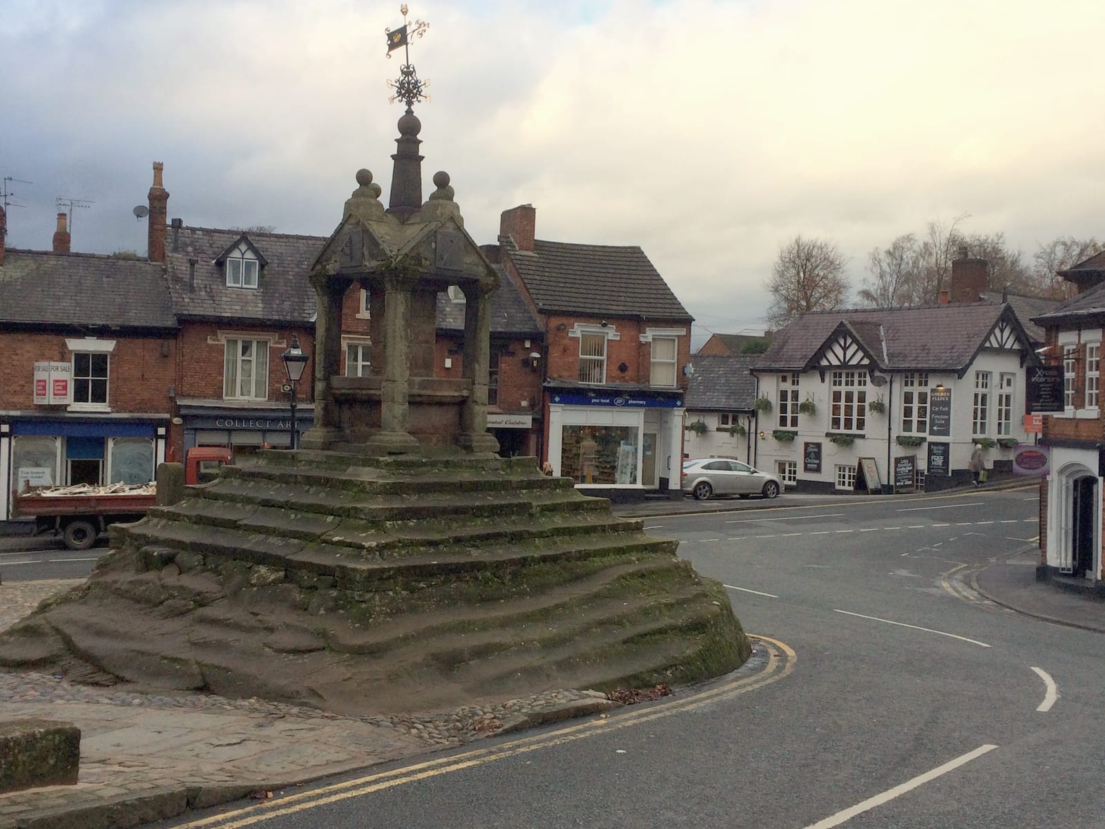 The sandstone Cross in the centre of Lymm village