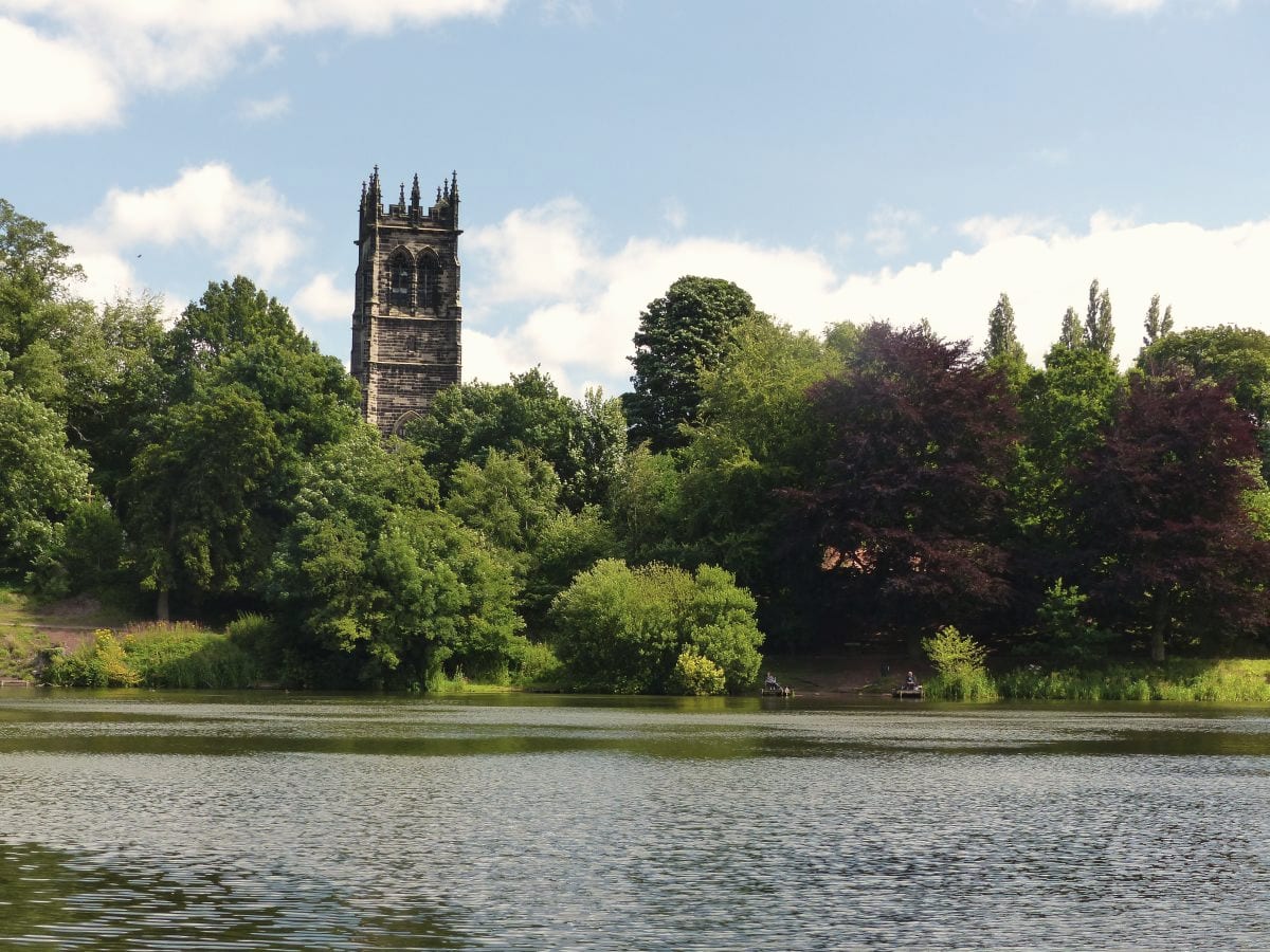 Lymm Dam with St Mary's Church above the trees